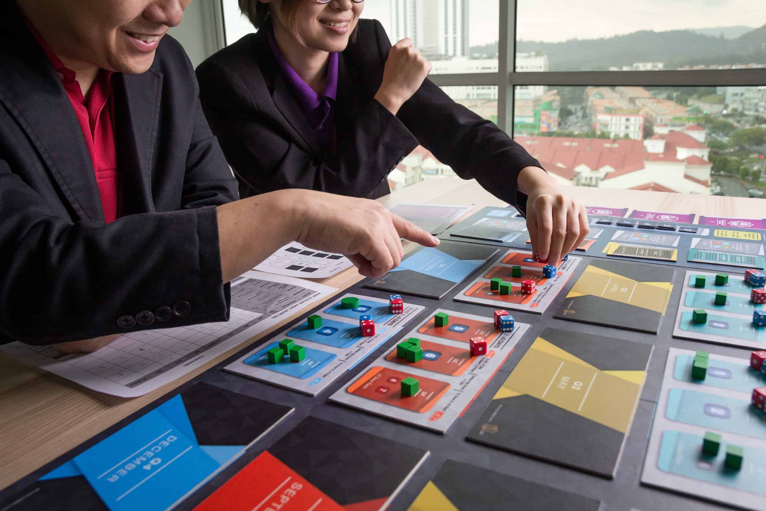 Participants tracking decisions during a Think Codex business simulation